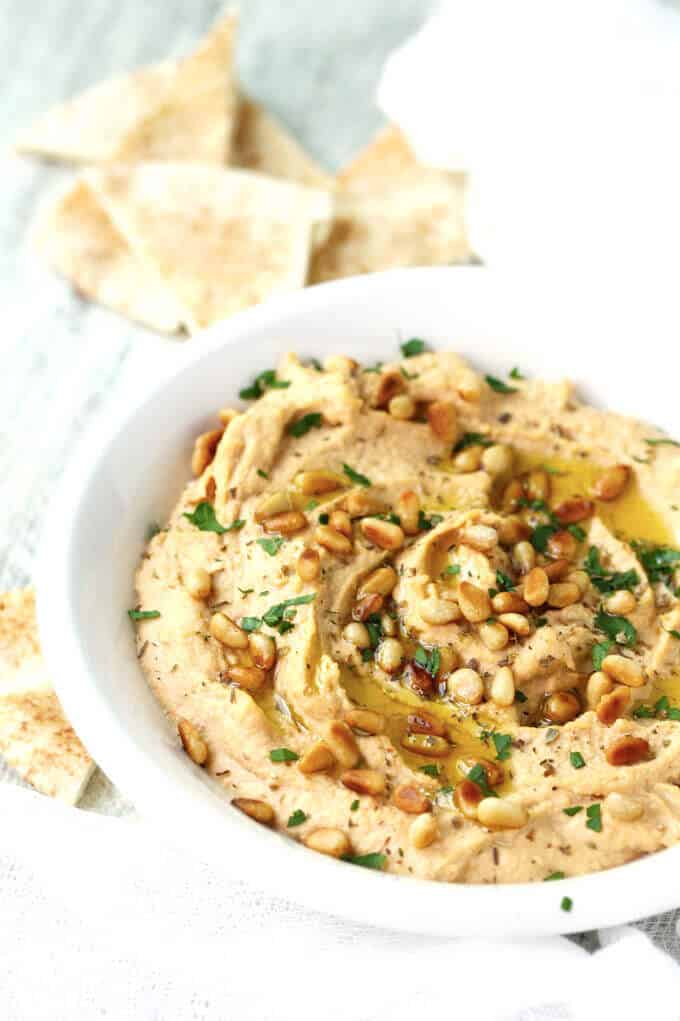 Chipotle Hummus with Roasted Pine Nuts is very simple and delicious with a hint of smokiness from spicy chipotles and nice crunch from roasted pine nuts.