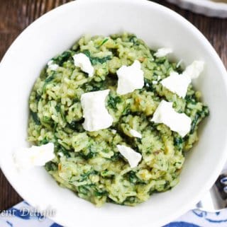 Greek Rice with Spinach served in a bowl with Feta Cheese