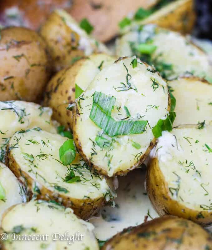 New Dill Potatoes with Scallion Cream Sauce - Polish summer staple side dish. This type of potatoes are the creamiest out there and they are only available for the short period of time. Hurry up, get some on your local farmer's market and follow this recipe to try the best potatoes you have ever tasted.