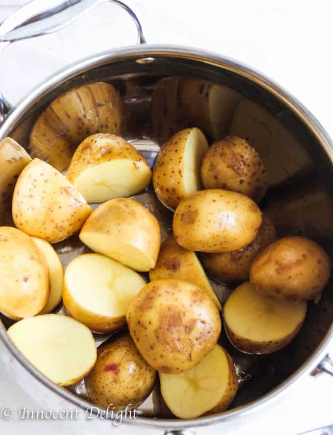 New Dill Potatoes with Scallion Cream Sauce - Polish summer staple side dish. This type of potatoes are the creamiest out there and they are only available for the short period of time. Hurry up, get some on your local farmer's market and follow this recipe to try the best potatoes you have ever tasted.