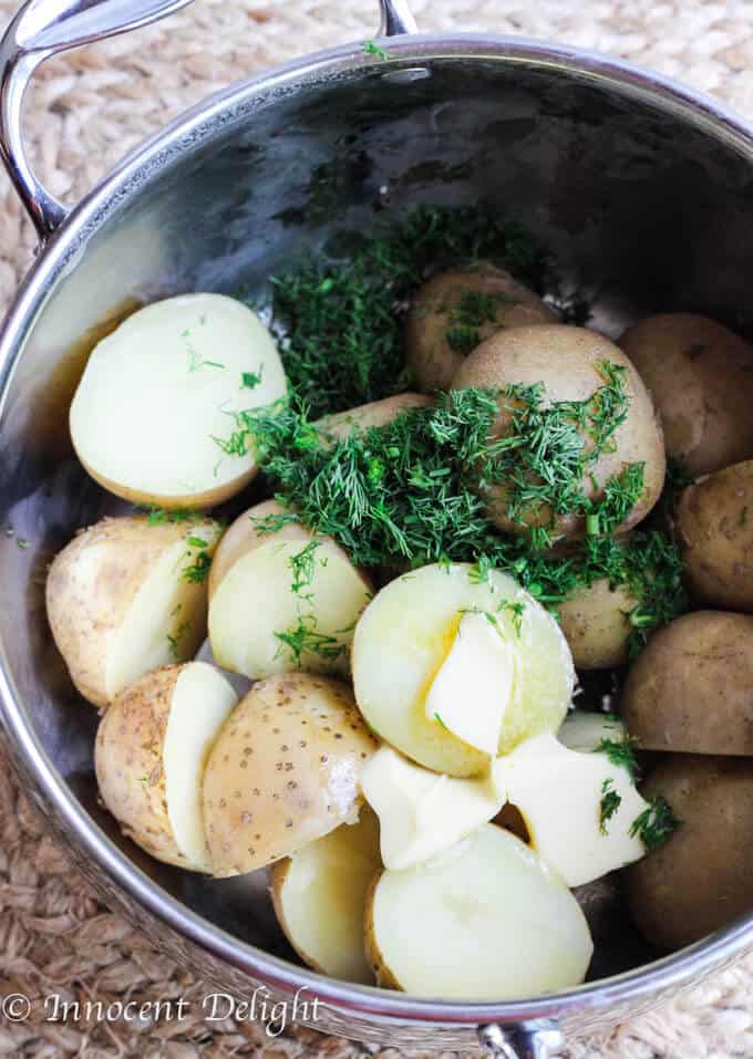 New Dill Potatoes with Scallion Cream Sauce - Polish summer staple side dish. This type of potatoes are the creamiest out there and they are only available for the short period of time. Hurry up, get some on your local farmer's market and follow this recipe to try the best potatoes you have ever tasted.