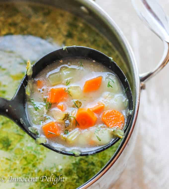 Traditional Polish Dill Pickle Soup - aka Zupa Ogorkowa. The most popular Polish soup of them all. For some it may sound strange, but if most Polish kids love it, then there must be something to it. Polish pickle soup in a pot with soup spoon