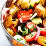 Summer Panzanella with Garlic Butter Bread - this popular Italian salad is a perfect addition to any summer meal or BBQ. Crusty bread that's been infused with garlic butter makes it irresistible.