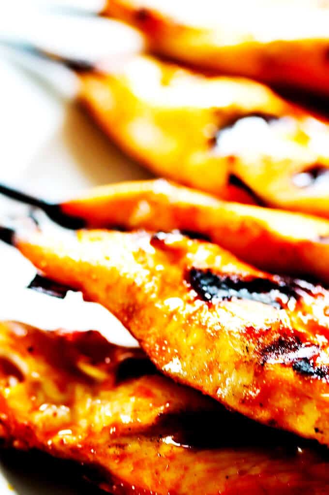 Honey Harrisa Chicken Skewers with Garlic Mint Sauce - amazing combination of Mediterranean flavors in these super tasty skewers with a dollops of refreshing garlic mint sauce. My guests couldn't get enough.