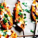 Honey Harrisa Chicken Skewers with Garlic Mint Sauce - amazing combination of Mediterranean flavors in these super tasty skewers with a dollops of refreshing garlic mint sauce. My guests couldn't get enough.
