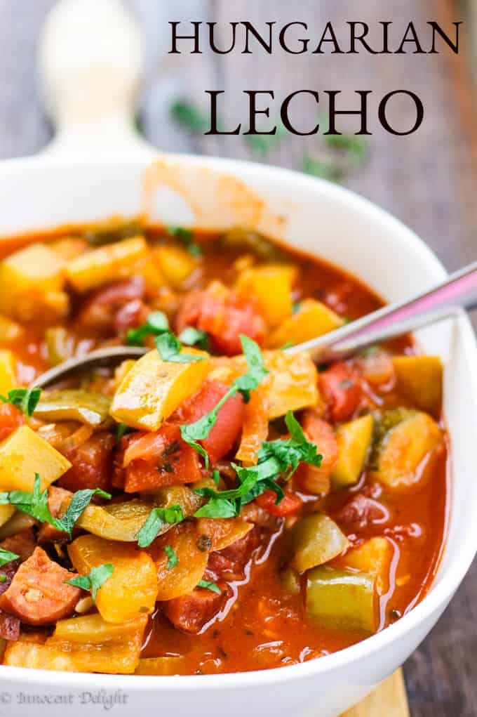 This tomato and peppers stew (Hungarian Lecho or Lescho) dish uses the freshest summer ingredients like ripe tomatoes, green and banana peppers and luscious zucchinis. When it simmers, the house smells incredible. Hungarian Lecho (Tomato and Pepper Stew) in a serving bowl