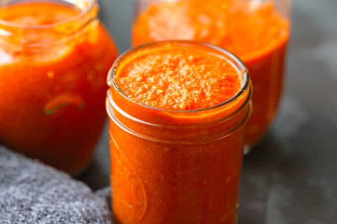 Romesco Sauce - famous Spanish sauce with roasted peppers, tomatoes, onions, garlic, almonds, bread, olive oil, vinegar, and Spanish Smoked Paprika. Easy and delicious. Easy Romesco Sauce recipe
