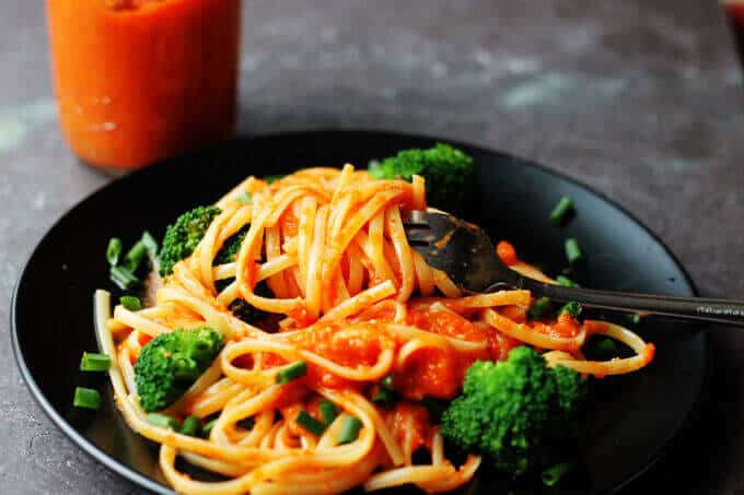 Linguine with Broccoli and Romesco Sauce is an amazing pasta dish with a uniquely Spanish twist. Freshly cooked linguine is tossed with broccoli and a sauce made of roasted red peppers, tomatoes, onions and toasted almonds. Simply delicious.
