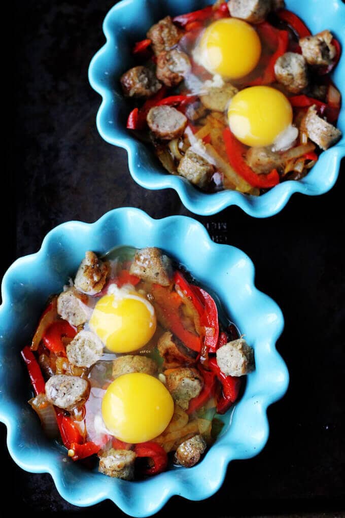 Oven Baked Eggs with Sausage, Peppers & Onions are super easy to make yet absolutely delicious. They're also elegant and perfect for special occasions, like Mother's Day.
