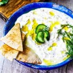 Traditional Greek Tzatziki Recipe combines real thick greek yogurt, seedless cucumber, garlic, dill and splash of vinegar and olive oil. It's a perfect sauce that can be paired with any meals like: grilled meats, vegetables, sandwiches, pitas or salads.