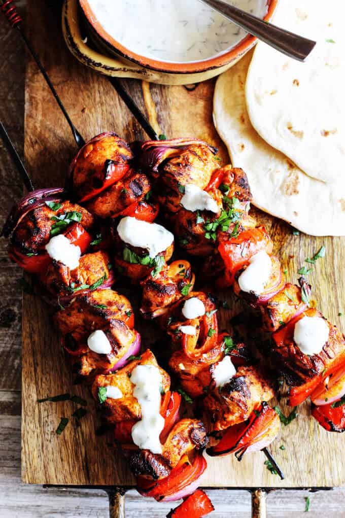 Mediterranean Chicken Kebabs with Garlic Yogurt sauce are packed with flavor. Marinated in Mediterranean spices, garlic and lemon, grilled to perfection and topped with cooling garlic yogurt sauce these chicken skewers are real winners.