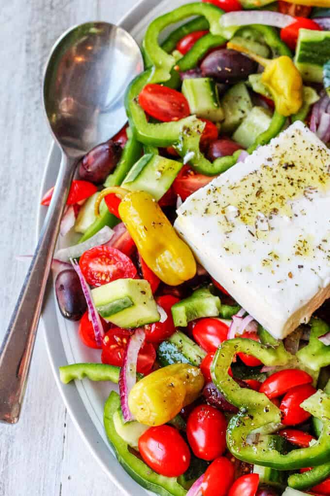 Whether it's a New Year resolution or perhaps a long-term desire to eat healthy, this compilation of 35 Amazing Detox Salads will definitely help you stay on track Horiatiki Salad with Golden Greek Peperoncini combines the freshest ingredients of seasonal tomatoes, cucumbers, green peppers, red onions, tangy kalamata olives and creamy feta with mildly piquant, fruity flavor Mezzetta Peperoncini. #DontForgettaMezzetta #Mezzetta #Ad