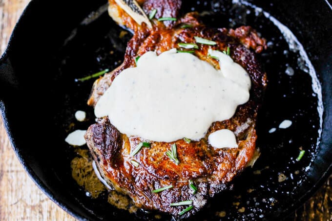 Pan-Seared Ribeye with Cracked Pepper & Mahon Menorca Cheese Sauce is a super easy and quick idea for any Holiday dinner. It just takes 15 minutes, from start to finish. You can’t beat that! #Ad #MahonCheese