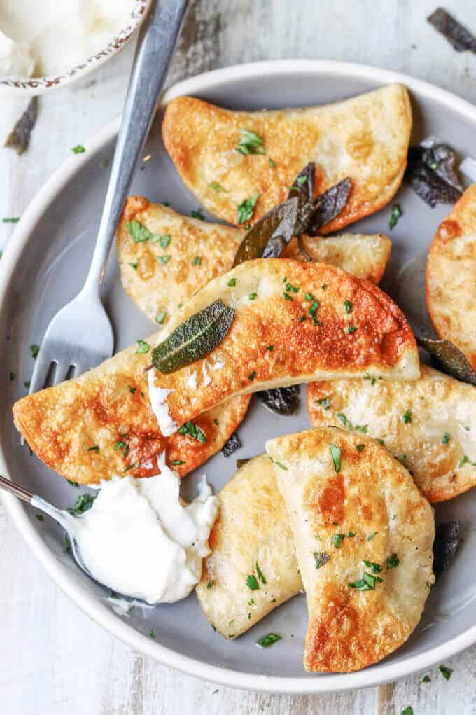 Roasted Butternut Squash Feta Pierogi is an amazing dish that combines American fall flavors with a taste from the Greek islands, wrapped in Polish dough