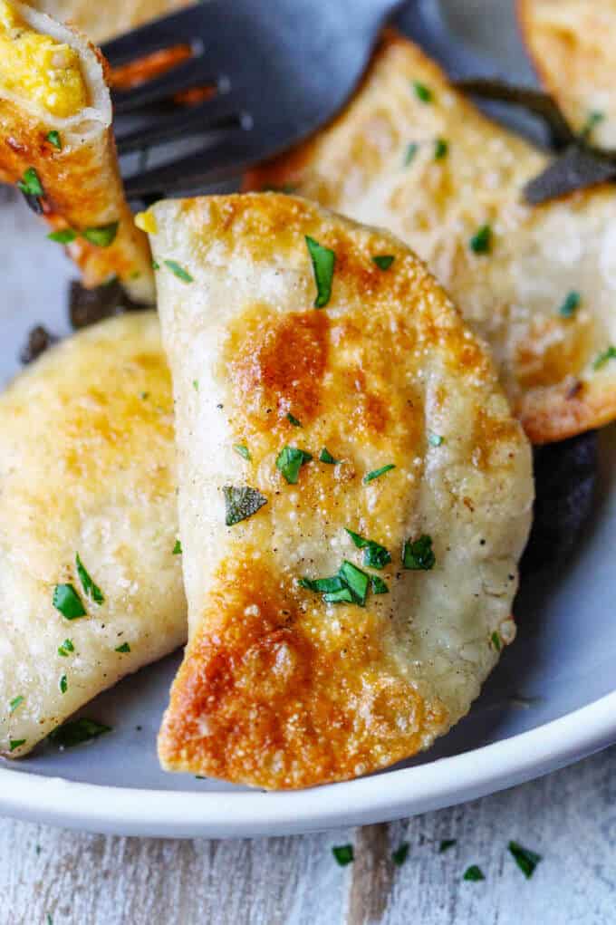 Roasted Butternut Squash Feta Pierogi is an amazing dish that combines American fall flavors with a taste from the Greek islands, wrapped in Polish dough