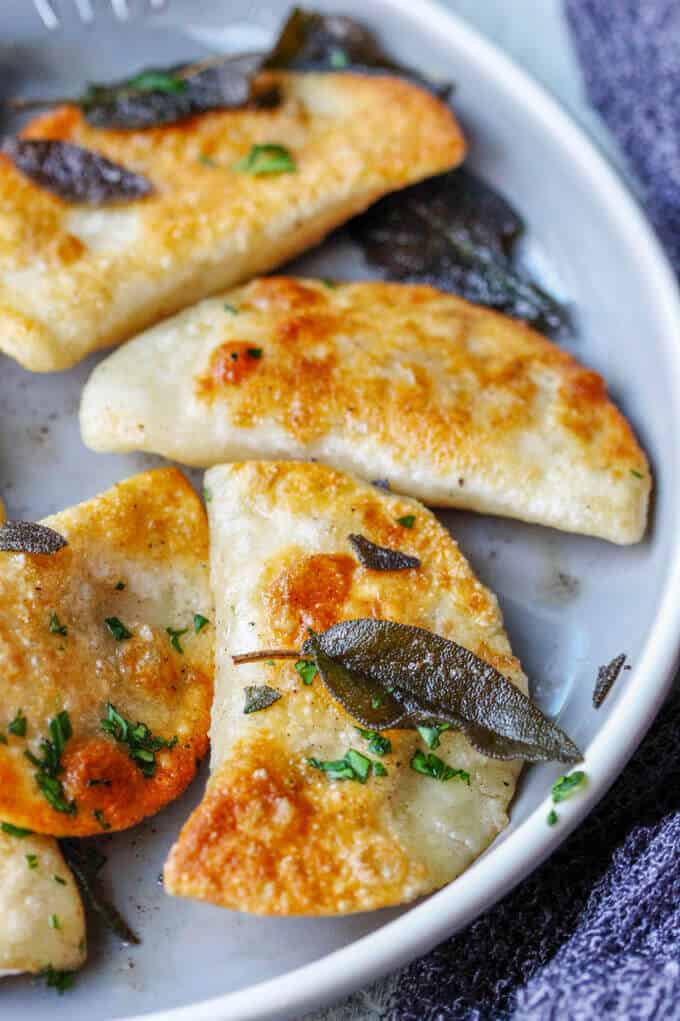 Roasted Butternut Squash Feta Pierogi is an amazing dish that combines American fall flavors with a taste from the Greek islands, wrapped in Polish dough