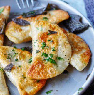 Roasted Butternut Squash Feta Pierogi is an amazing dish that combines American fall flavors with a taste from the Greek islands, wrapped in Polish dough