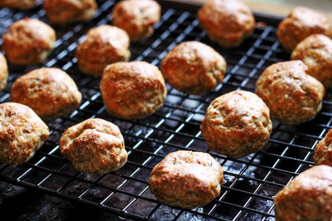 Buffalo Turkey Meatballs are a perfect appetizer for the Big Game. They're also a lighter alternative to a traditional chicken buffalo wings, not only because they have less fat, but also because they're baked, not fried. Not to mention they're also super easy to make. Turkey Meatballs on sheet rack
