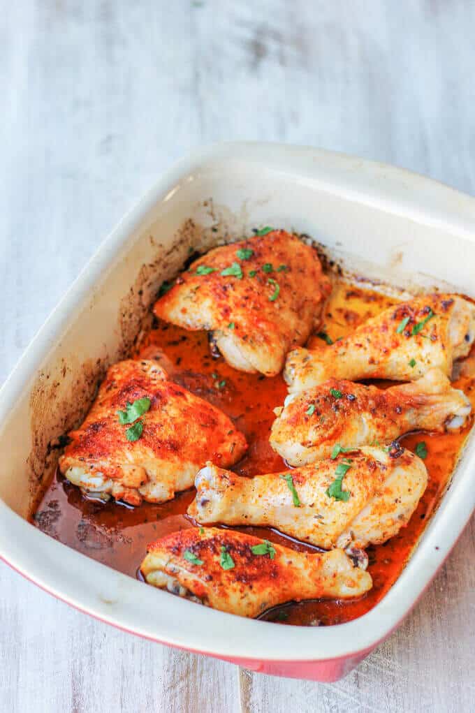 Oven Roasted Chicken Legs - either thighs, drumsticks, or even whole; can be the easiest dinner one can make when the time is scarce. 5 minutes prep time is all you'll need. Oven Roasted Chicken Legs in a casserole dish, diagonal, on white board