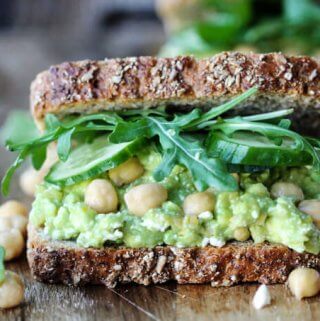 Smashed chickpea avocado feta sandwich, close up, horizontal
