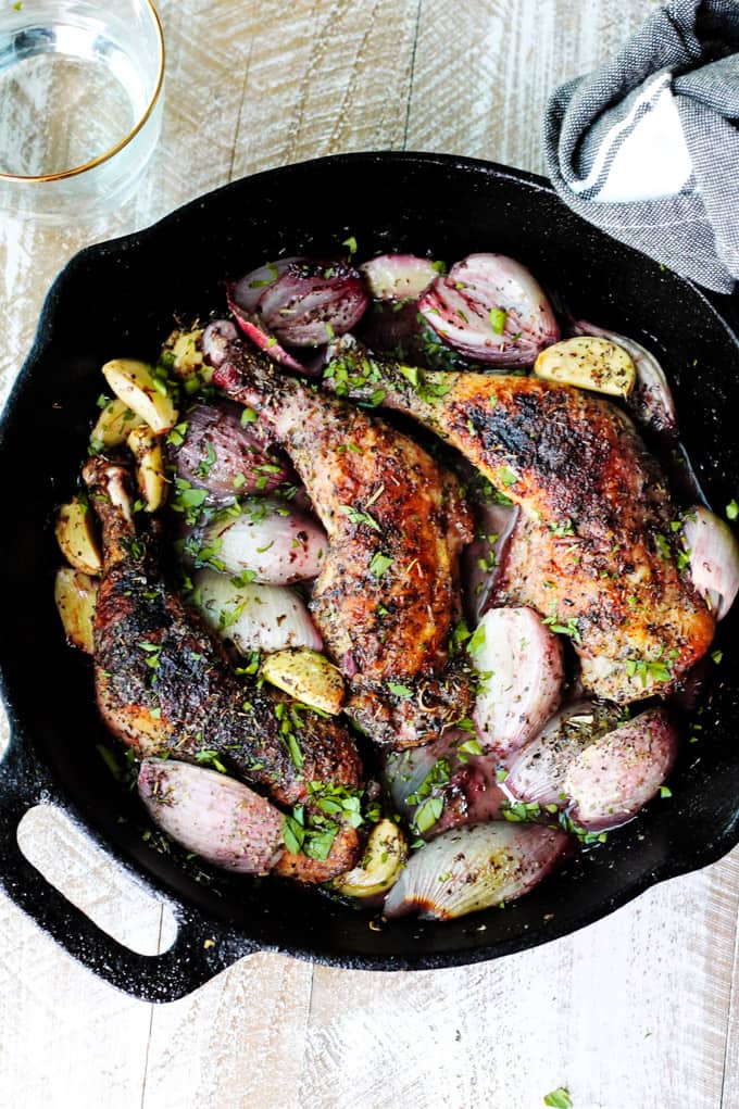French chicken Provencal in a skillet with shallots and garlic