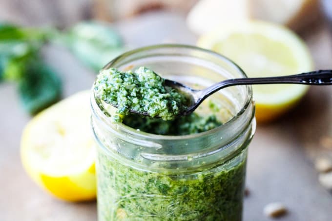 Lemon basil pesto on a spoon with jar