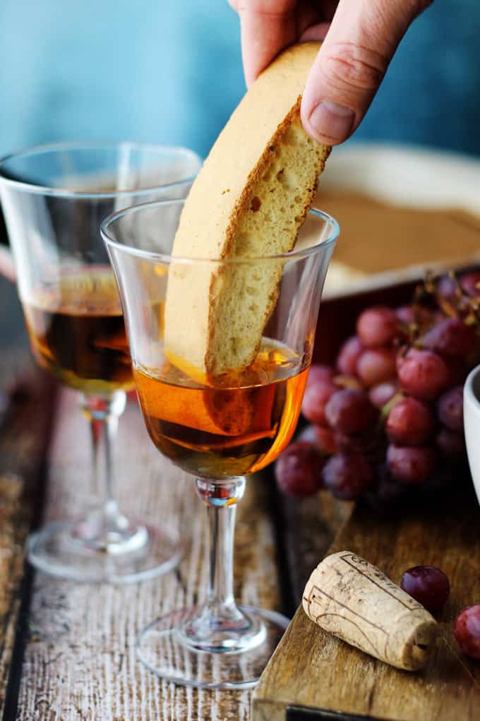 Dipping biscotti in Italian Dessert wine Vin Santo