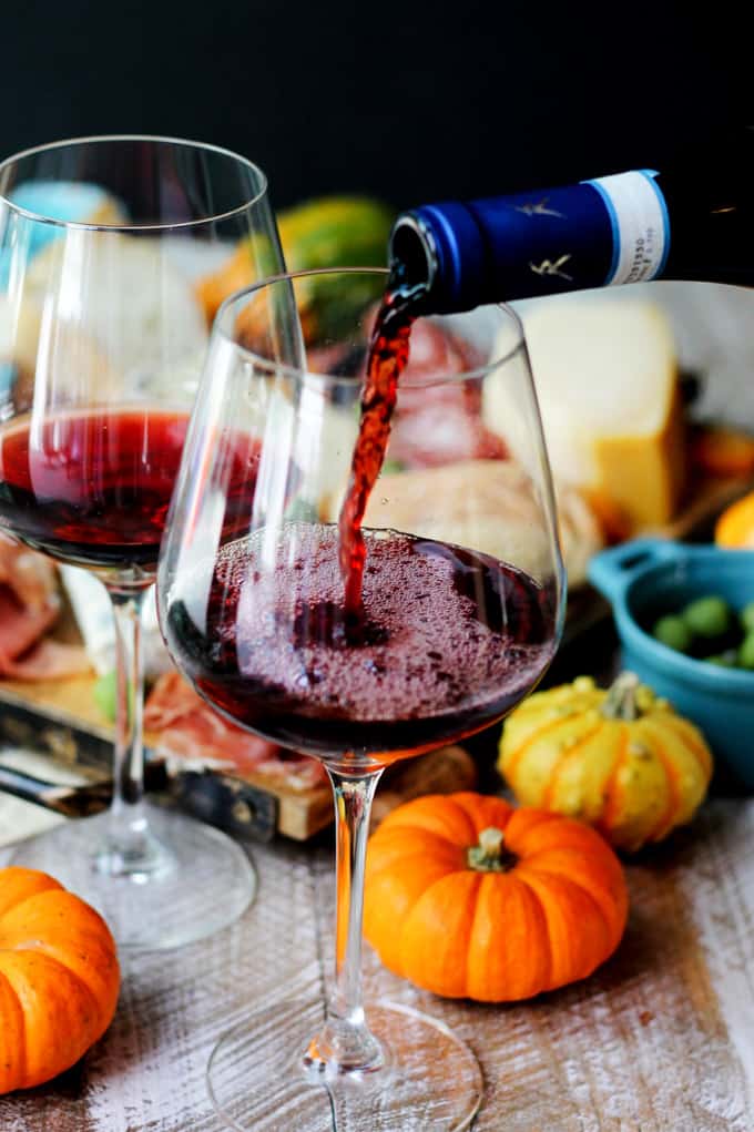 Pouring red Italian wine into a glass