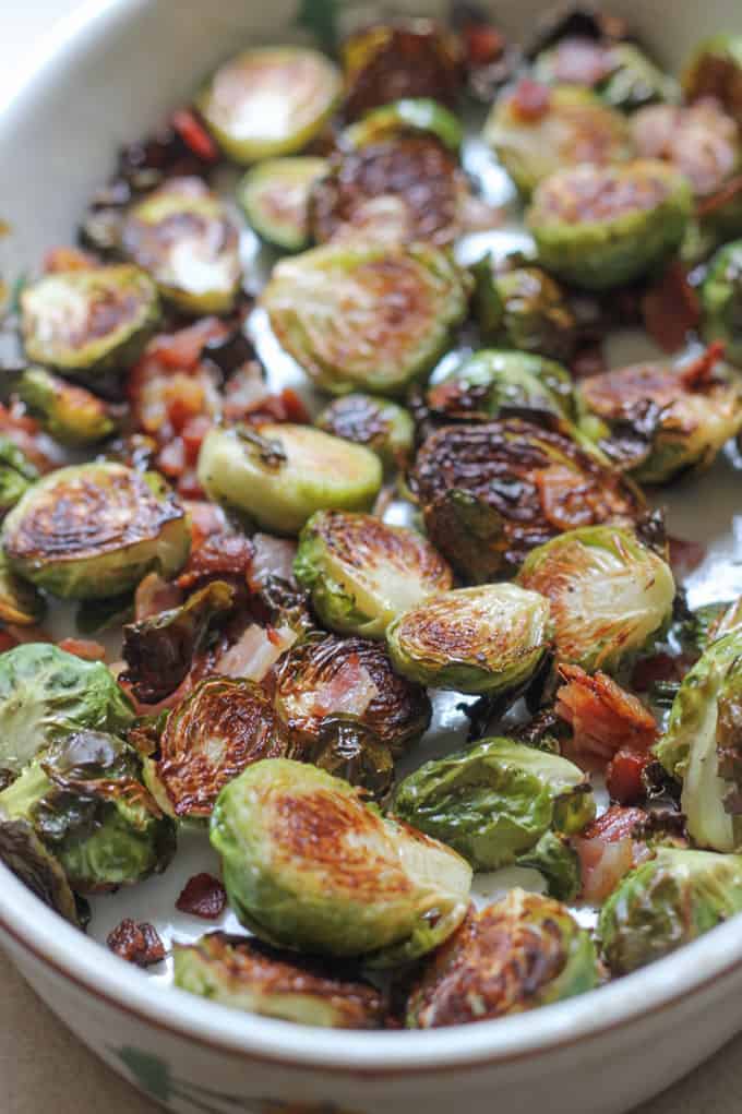 Roasted brussels sprouts with bacon in a baking dish