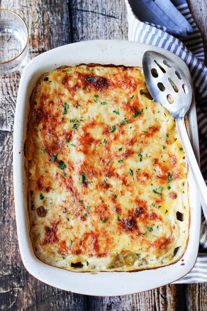 Acorn Butternut Squash Casserole with a serving spoon