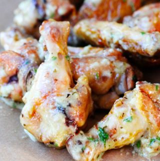 Garlic parmesan chicken wings on a board