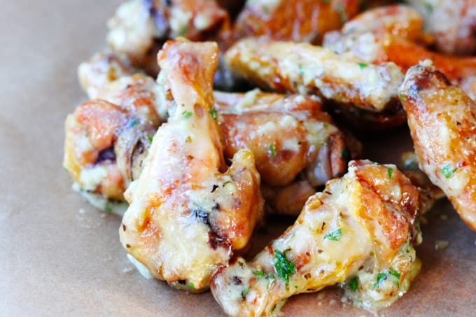 Garlic parmesan chicken wings on a board