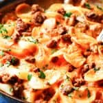 Pasta in vodka sauce in a skillet with fork