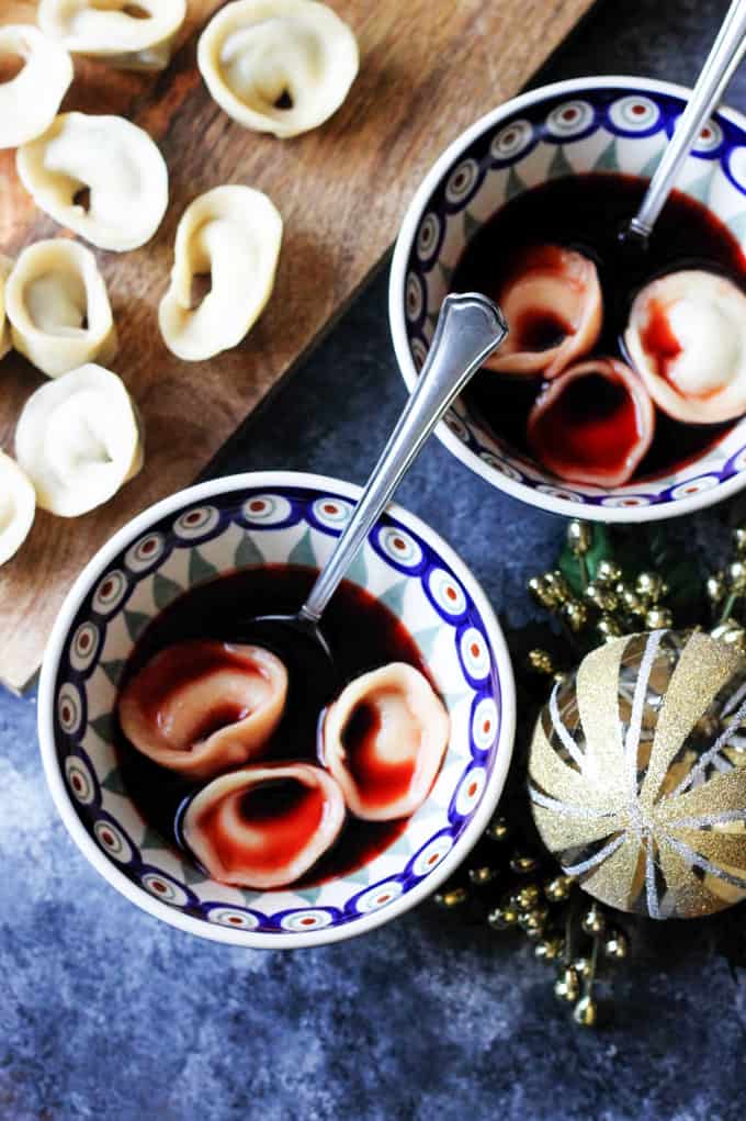 In Poland Mushroom Pierogi called "Uszka" are traditionally served in Borscht on Christmas Eve. They're made from both dry and fresh mushrooms, and a simple pierogi dough of flour, water, milk, and butter. They're beautiful and easier to make than you'd think. Borscht with Uszka in bowls