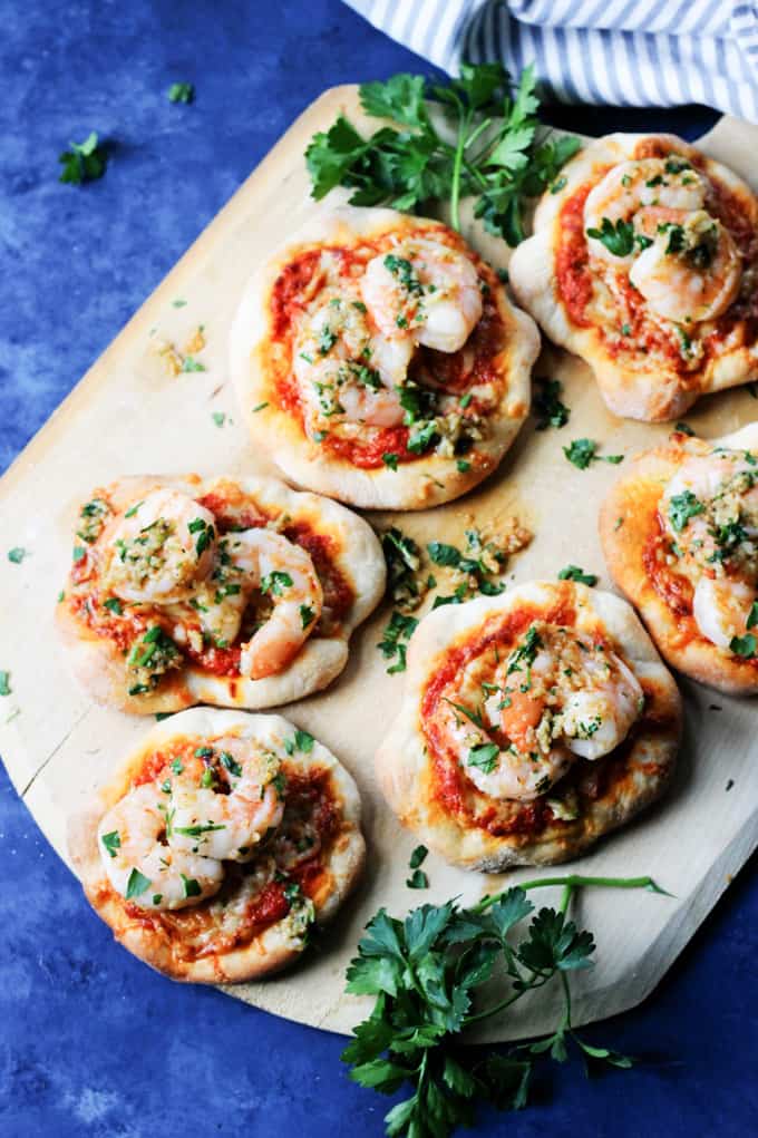 Pizzette with shrimp on a pizza peel