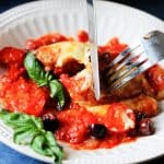 Veal Rollatini on a plate with fork and knife