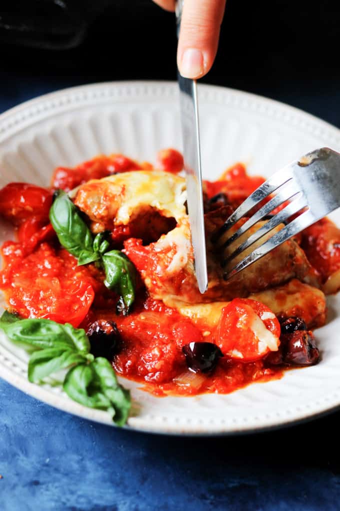 Veal Rollatini on a plate with fork and knife