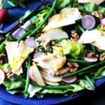 French salad on a blue serving plate