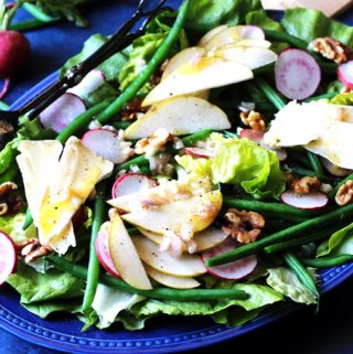 French salad on a blue serving plate