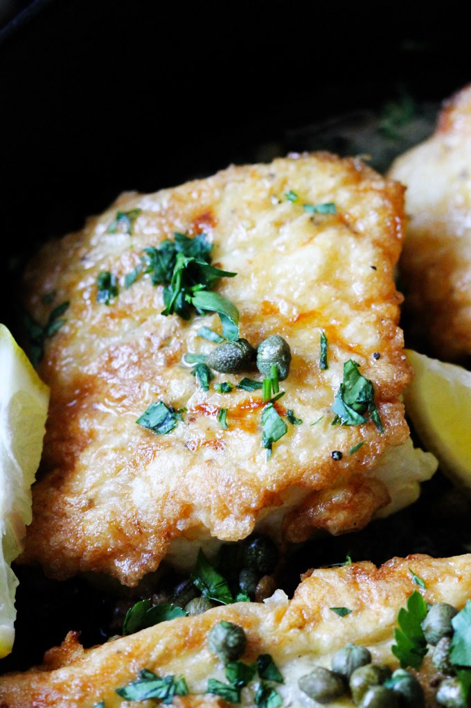 This Pan Fried Cod with Meuniere Sauce comes together in just 15 minutes! No gimmicks...it really is super simple. With just a few steps and your dinner is ready. And it will wow your kitchen patrons. Close up shot of pan fried cod with brown butter lemons sauce and capers