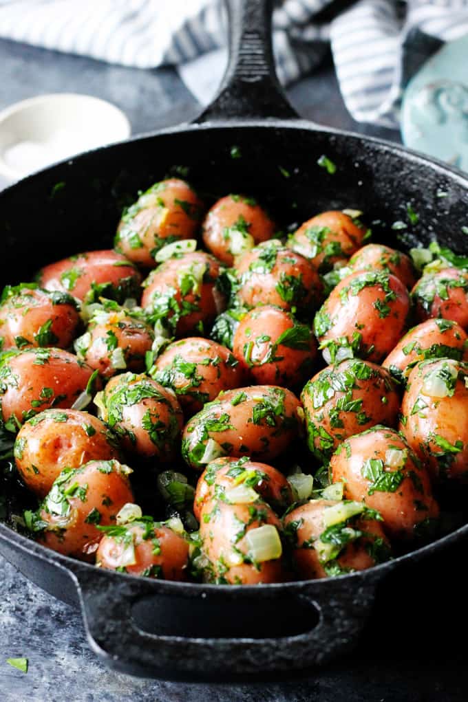 Parsley Potatoes are very easy to make. They very fragrant and filling, yet you only need 4 ingredients to make them! It's a perfect side dish for any meat or fish. Parsley potatoes in cast iron skillet