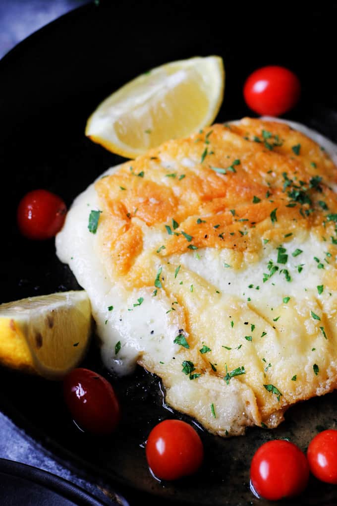 Greek Saganaki on a plate with lemons