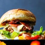 Turkey burger with Bayonne Ham with side salad on a plate