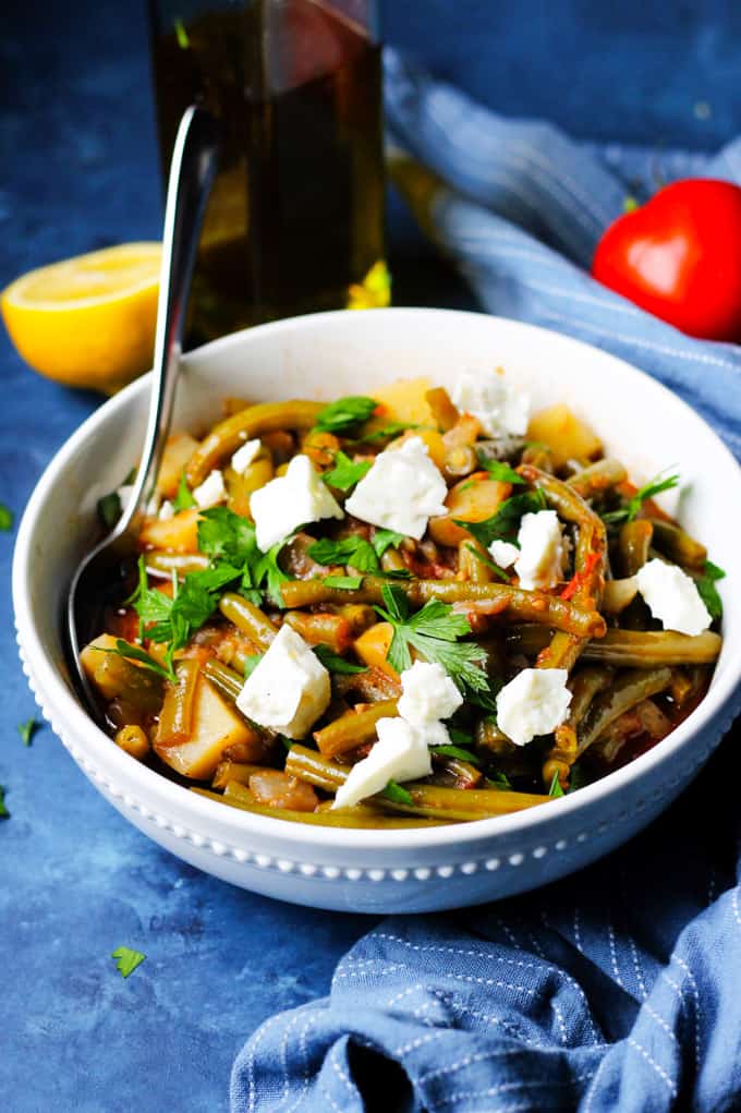 Greek green beans in a bowl with olive oil.