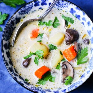 Homemade mushroom chunky soup in a blue bowl