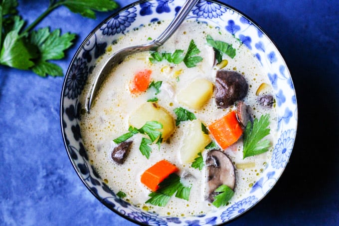 Homemade mushroom chunky soup in a blue bowl