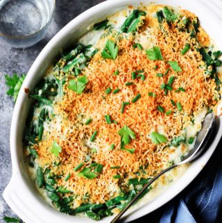 Green bean casserole in white baking dish