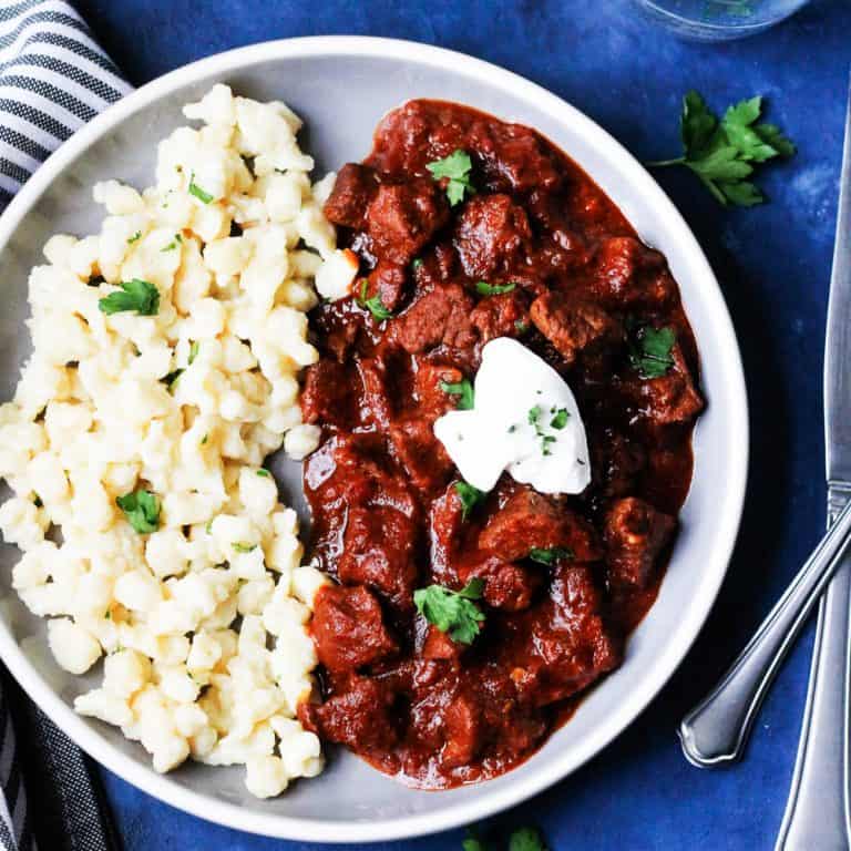 Porkolt Hungarian Goulash on a plate with noodles