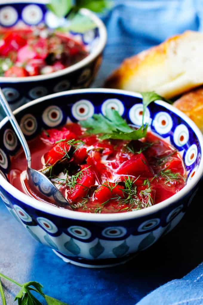 Botwinka Polish Soup in a blue bowl with spoon