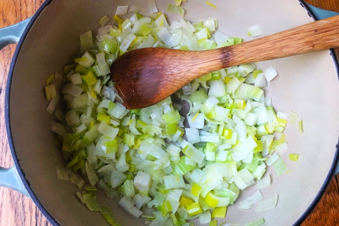Onions and leeks cooking in a pot